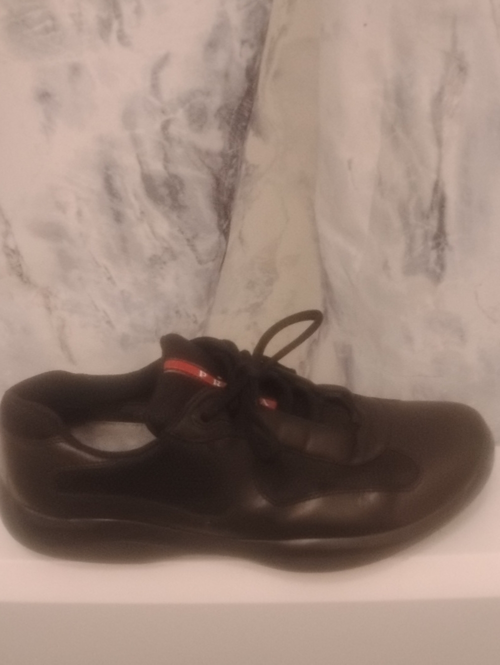 Prada Black Leather Sneaker with Red Accent
